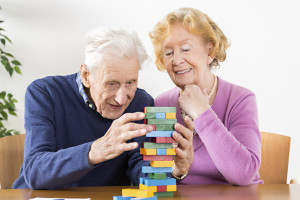 Senior couple stay active with Jenga