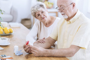 Senior couple looking at prescriptions