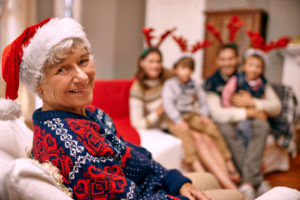 A happy grandmother with her family on Christmas Eve