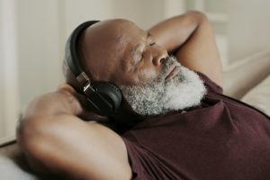 relaxed senior man listening to headphones