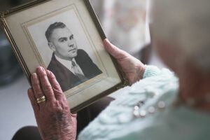 Senior woman looking at an old photo