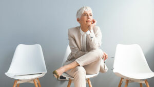 Senior woman sitting down thinking