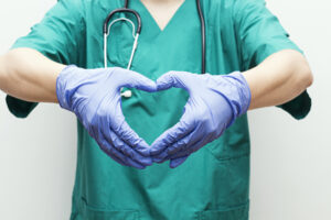 nurse making heart shape with hands